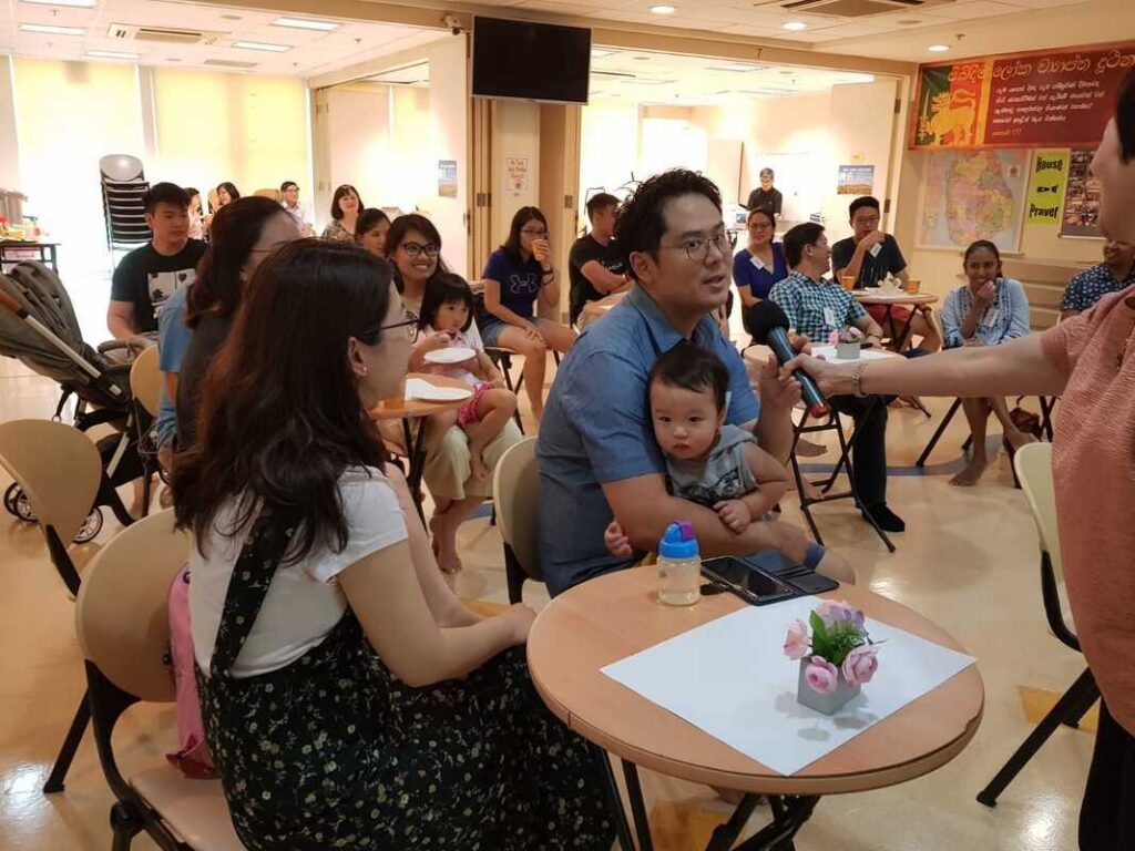 Parents with young children at a Careworks family event